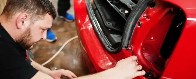tech working on bumper