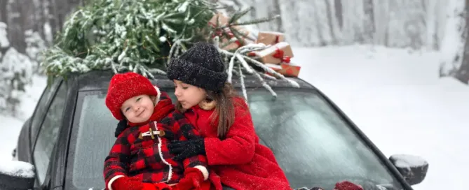 kids on car in snow